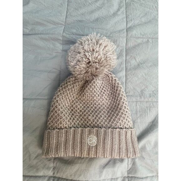 Women Calvin Klein Minimalist Knitted Winter Beanie in Beige/Tan - Picture 1 of 8